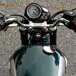 The Bonnie's speedo sits forlornly by the narrower handlebar, lacking the traditional Britbike tach to keep it company.  